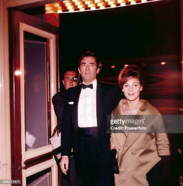 American actor Gregory Peck and his wife Veronique Passani arrive at the Astoria cinema in London for the premiere of the film 'Inherit The Wind' in...