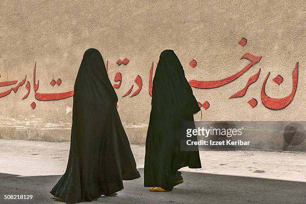 street scene women in black chador in shiraz, iran - veil imagens e fotografias de stock