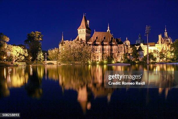 Vajdahunyad Castle is one of the romantic castles in Budapest, Hungary, located in the City Park by the boating lake.