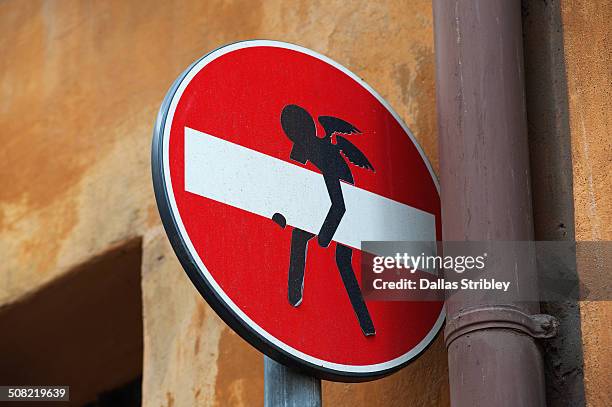 no access street sign with an angel, in rome - street art stock-fotos und bilder