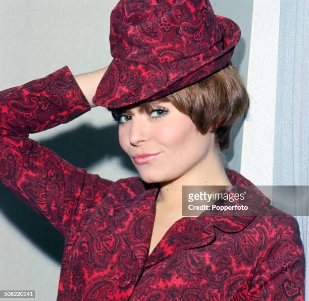 British actress Isla Blair posed wearing a matching red paisley petterned hat and shirt in 1966.
