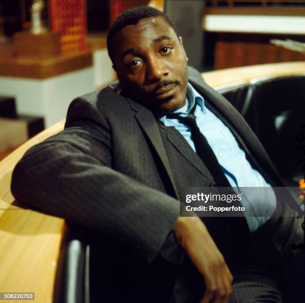 American comedian and actor Dick Gregory posed on the set of the television drama 'Armchair Theatre - Neighbours' in 1966.