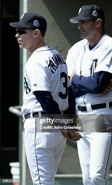 Manager Alan Trammell and bench coach Kirk Gibson of the Detroit Tigers look on from the dugout during the MLB game against the Toronto Blue Jays at...