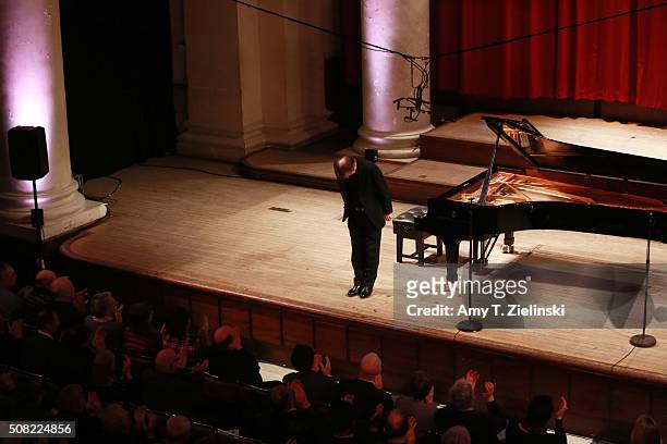 Scottish pianist Steven Osborne receives applauds from the audience after a program of Debussy, Schubert and Rachmaninov's Etudes tableaux at a...
