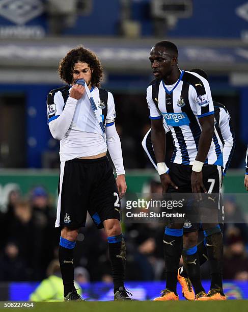 Newcastle players Fabricio Coloccini and Moussa Sissoko react after the first Everton penalty is given during the Barclays Premier League match...
