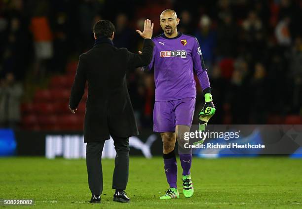 Quique Flores the manager of Watford and Goalkeeper Heurelho Gomes of Watford celebrate following the 0-0 draw during the Barclays Premier League...