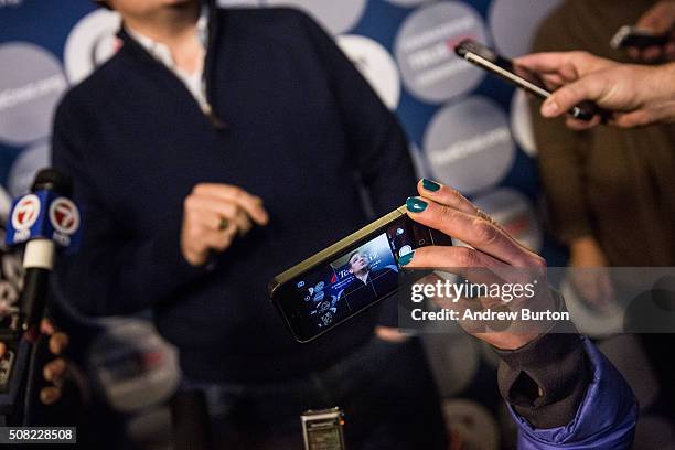 Reporter takes a photo of Republican presidential hopeful Sen. Ted Cruz at a press conference before a campaign event at The Village Trestle...