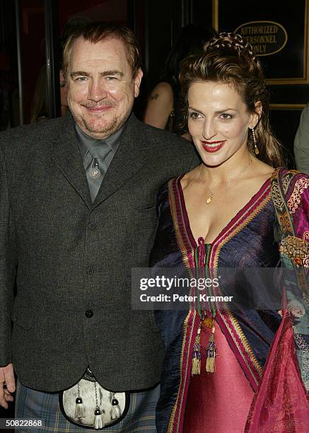 Actor Brian Cox and wife Nicole Ansari attend the premiere of "Troy" on May 10, 2004 in New York City.