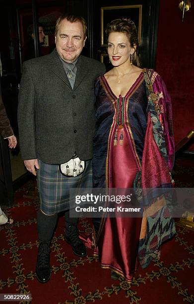 Actor Brian Cox and wife Nicole Ansari attend the premiere of "Troy" on May 10, 2004 in New York City.