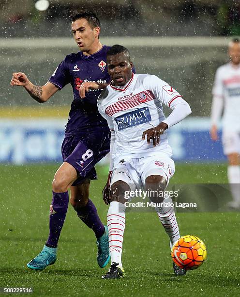 Matias Vecino of Fiorentina competes for the ball with Isaac Cofie of Carpi during the Serie A match between ACF Fiorentina and Carpi FC at Stadio...