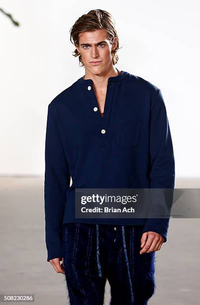 Model walks the runway during the Palmiers du Mal runway show during New York Fashion Week Men's Fall/Winter 2016 at Skylight at Clarkson Sq on...