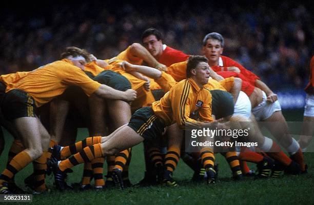Nick Farr Jones of Australia passes the ball during a Rugby Union match between Wales and Australia held in Wales, United Kingdom. Australia won 28-9.