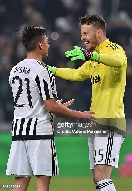 Paulo Dybala of Juventus FC celebrates victory with Norberto Murara Neto at the end of the TIM Cup match between Juventus FC and FC Internazionale...