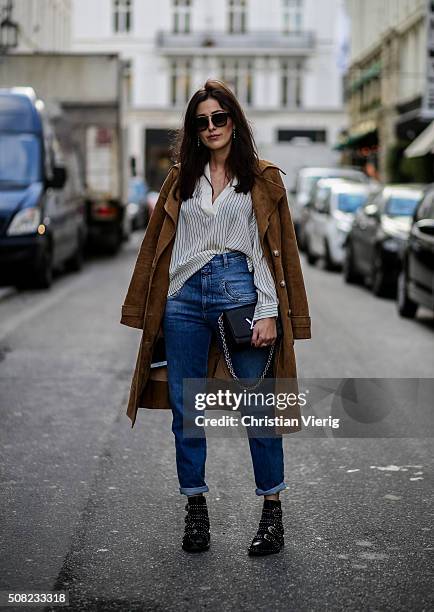 Sylvia Haghjoo wearing Givenchy boots, Closed jeans, Gestuz blouse, Celine sunglasses, Louis Vuitton bag, Dimitri coat outside Jesper Hovring & Great...