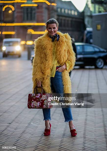 Janka Polliani wearing Saks Potts coat, Gucci bag and shoes outside Lala Berlin during the Copenhagen Fashion Week Autumn/Winter 2016 on February 3,...