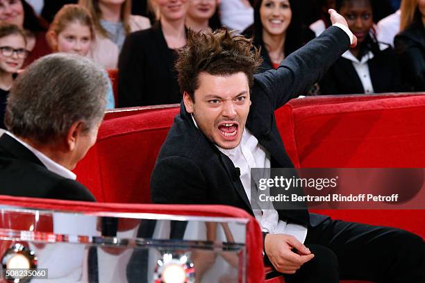 Presenter of the show Michel Drucker and the Youngest Main Guest of the Show, Actor and Humorist Kev Adams attend the 'Vivement Dimanche' French TV...