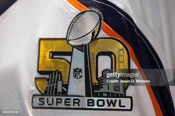 Detailed view of a Super Bowl 50 logo stitched on a Denver Broncos uniform during the NFL Experience exhibition before Super Bowl 50 at the Moscone...