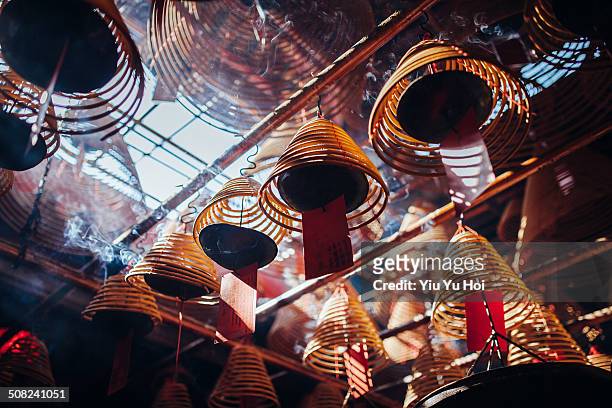 incense coils hanging on the roof of temple - buddhist goddess stockfoto's en -beelden