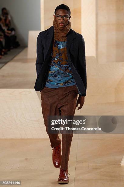 Model walks the runway wearing Perry Ellis during New York Fashion Week Men's Fall/Winter 2016 at Skylight at Clarkson Sq on February 3, 2016 in New...