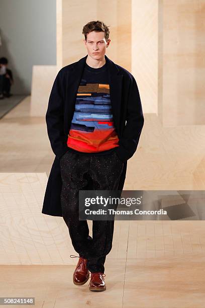 Model walks the runway wearing Perry Ellis during New York Fashion Week Men's Fall/Winter 2016 at Skylight at Clarkson Sq on February 3, 2016 in New...