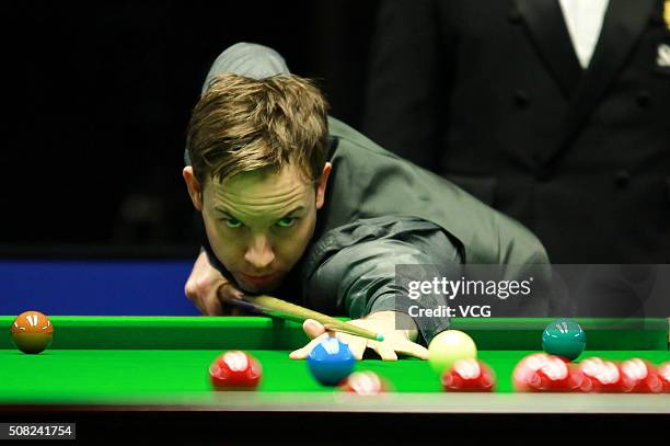 Ali Carter of England plays a shot during the first round match against Judd Trump of England on day one of German Masters 2016 at Tempodrom on...