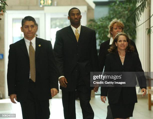 Los Angeles Lakers basketball player Kobe Bryant and his attorney Pamela Mackey walk to the courtroom inside the Eagle County Justice Center on the...