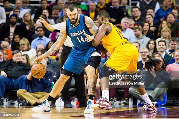 Nikola Pekovic of the Minnesota Timberwolves posts up against Tristan Thompson of the Cleveland Cavaliers during the first half at Quicken Loans...