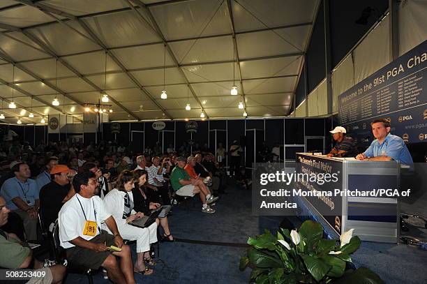 Kelly Elbin and Tiger Woods at a press conference in the media center at the 91st PGA Championship at Hazeltine National Golf Club in Chaska,...