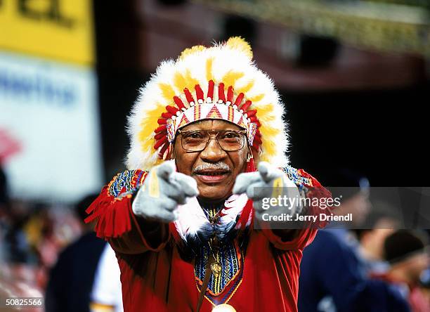 Washington Redskins fan "Chief Zee" watches the game against the Philadelphia Eagles on December 27, 2003 at FedEx Field in Washington, D.C.