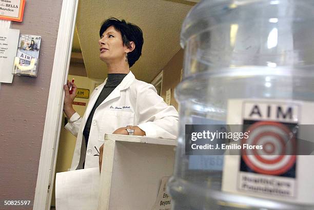 Dr. Sharon Mitchell speaks to a patient at the Adult Industry Medical Health Care Foundation clinic May 7, 2004 in Sherman Oaks, California. Mitchell...