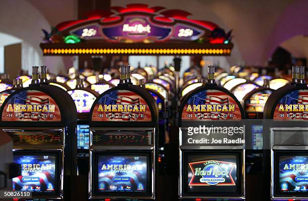 Slot machines wait for players May 11, 2004 during the grand opening for the Seminole Hard Rock Hotel and Casino in Hollywood, Florida. South...