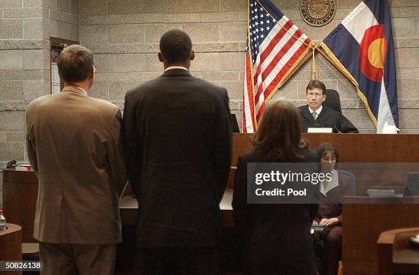 Lakers basketball player Kobe Bryant stands before Judge Terry Ruckriegle with Hal Haddon and Pamela Mackey inside Courtroom one at the Eagle County...
