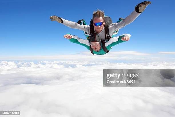 tandem skydiving - electronic vapor stock pictures, royalty-free photos & images