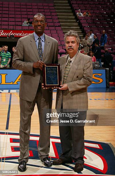 Albert King presents a Jr. NBA/WNBA Award to Jorge Parra before the New Jersey Nets host the Detroit Pistons in Game four of the Eastern Conference...