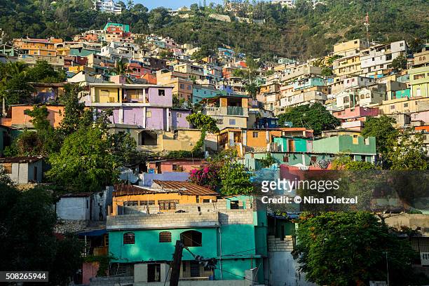 jalousie, slum painted in bright colors - port au prince stock pictures, royalty-free photos & images