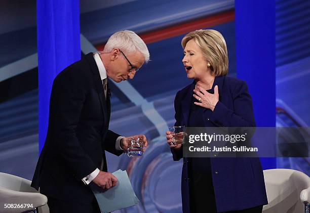 Democratic Presidential candidates Hillary Clinton stands with CNN anchor Anderson Cooper during a CNN and the New Hampshire Democratic Party hosted...