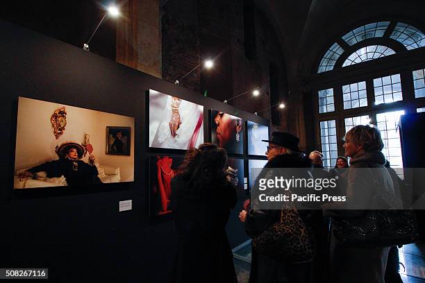 The visitors are checking out the photos during the "Fashion" exhibit. From 4 February to 2 May 2016, Palazzo Madama hosts the photo exhibition...