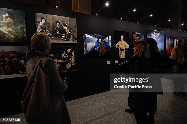 The visitors are checking out the photos during the "Fashion" exhibit. From 4 February to 2 May 2016, Palazzo Madama hosts the photo exhibition...