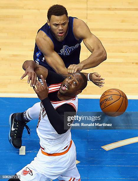 Dwyane Wade of the Miami Heat is fouled by Justin Anderson of the Dallas Mavericks in the second half at American Airlines Center on February 3, 2016...