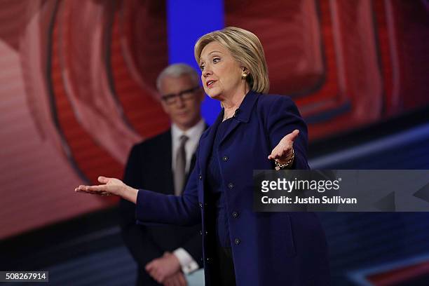 Democratic Presidential candidates Hillary Clinton stands on stage with CNN anchor Anderson Cooper during a CNN and the New Hampshire Democratic...