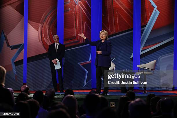 Democratic Presidential candidates Hillary Clinton stands on stage with CNN anchor Anderson Cooper during a CNN and the New Hampshire Democratic...