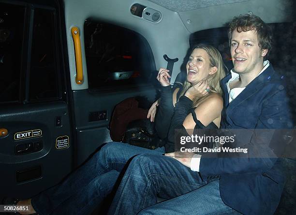 Tom Parker-Bowles and his girlfriend leave the Fiat Hydrogen - launch party at Sketch on May 11, 2004 in London.