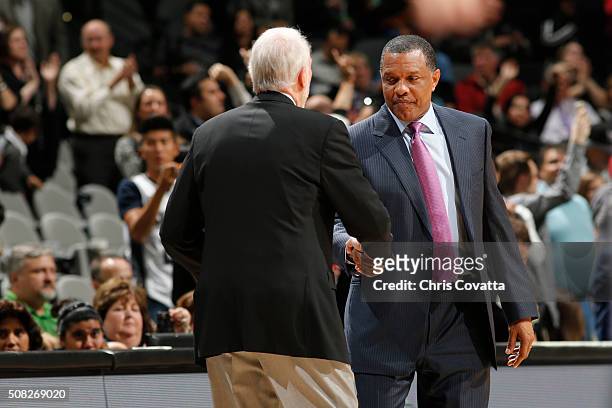 Head coach Alvin Gentry of the New Orleans Pelicans and head coach Gregg Popovich of the San Antonio Spurs shake hands after the game on February 3,...