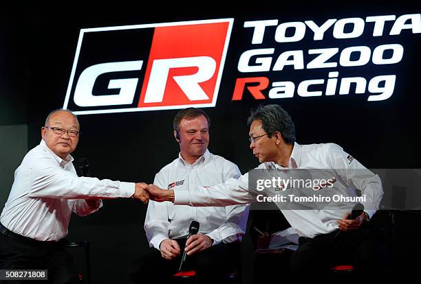 Toyota Motor Corp. Senior Managing Officer Koei Saga, left, shakes hands with Toyota Motorsport GmbH President Toshio Sato, right, as Tommi Makinen,...