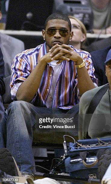 Musical artist Usher attends Game 4 of the Western Conference semi-finals between the San Antonio Spurs and the Los Angeles Lakers on May 11, 2004 at...