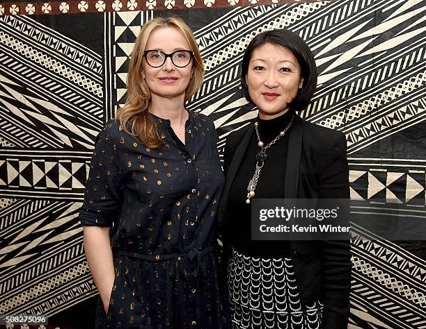 Actress Julie Delpy and Mme Fleur Pellerin, French Minister of Culture and Communications pose at La Residence de France on February 3, 2016 in...