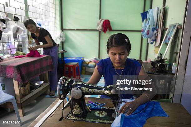 Seamstress sews a garment in Naypyidaw, Myanmar on Wednesday, Feb. 3, 2016. Myanmar's new popularly elected upper house of parliament voted Wednesday...