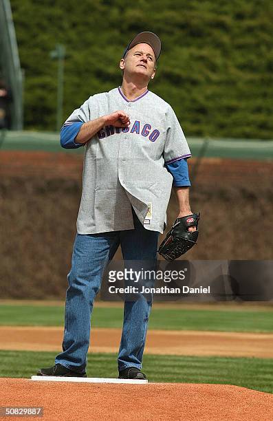 Actor Bill Murray stands on the mound as he prepares to throw the ceremonial first pitch prior to the Chicago Cubs home opener against the Pittsburgh...