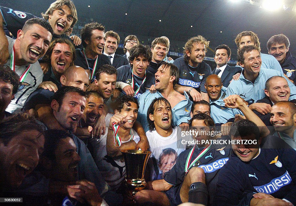 Lazio's players pose with the trophee af
