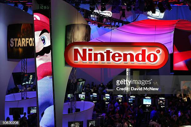 Crowds walk through the Nintendo exhibit on opening day of the 10th annual Electronic Entertainment Expo on May 12, 2004 in Los Angeles, California....